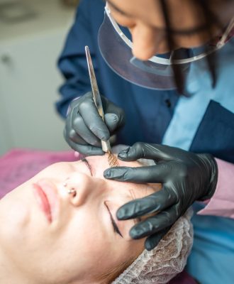 procedure-eyebrow-microblading-master-black-gloves-is-doing-blending-needle-models-brow